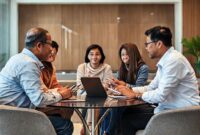 Beberapa orang pemimpin digital (laki-laki dan perempuan) dari berbagai latar belakang sedang berdiskusi dengan serius di sebuah ruangan modern, mencerminkan kolaborasi dan kepemimpinan dalam era digital.